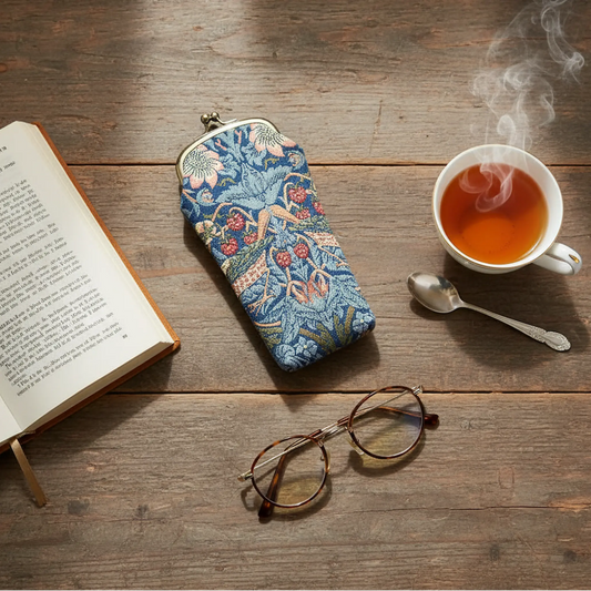 William Morris Strawberry Thief tapestry glasses case UK lifestyle flat lay with reading glasses tea and book countryside home
