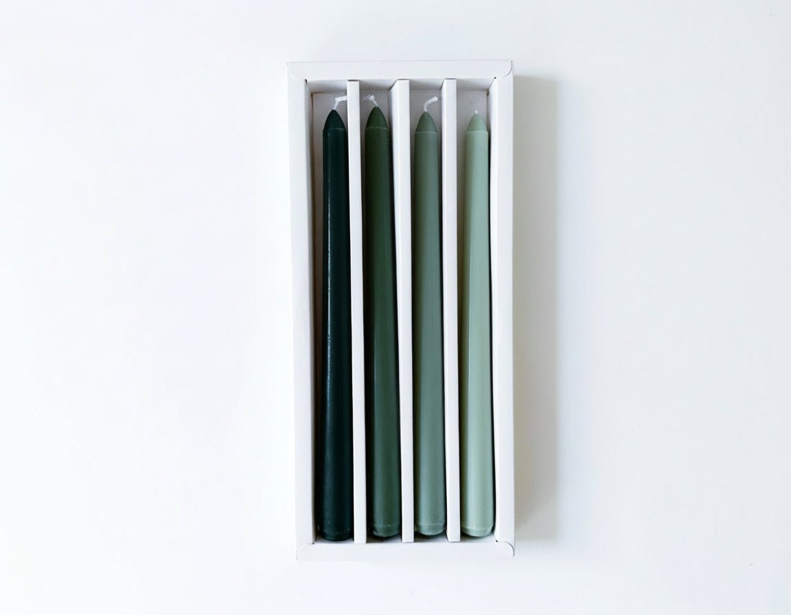 Woodland taper candles box of 4 rustic scented green displayed in packaging
