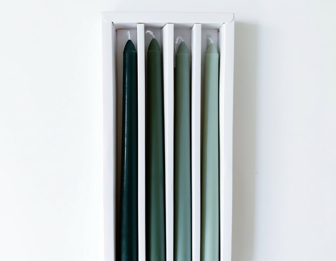 Woodland taper candles box of 4 rustic scented green displayed in white box packaging
