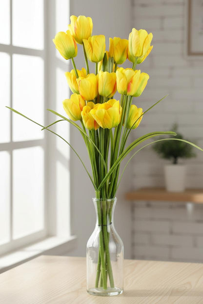Yellow tulip stems vase close-up silk petals UK elegant spring flowers